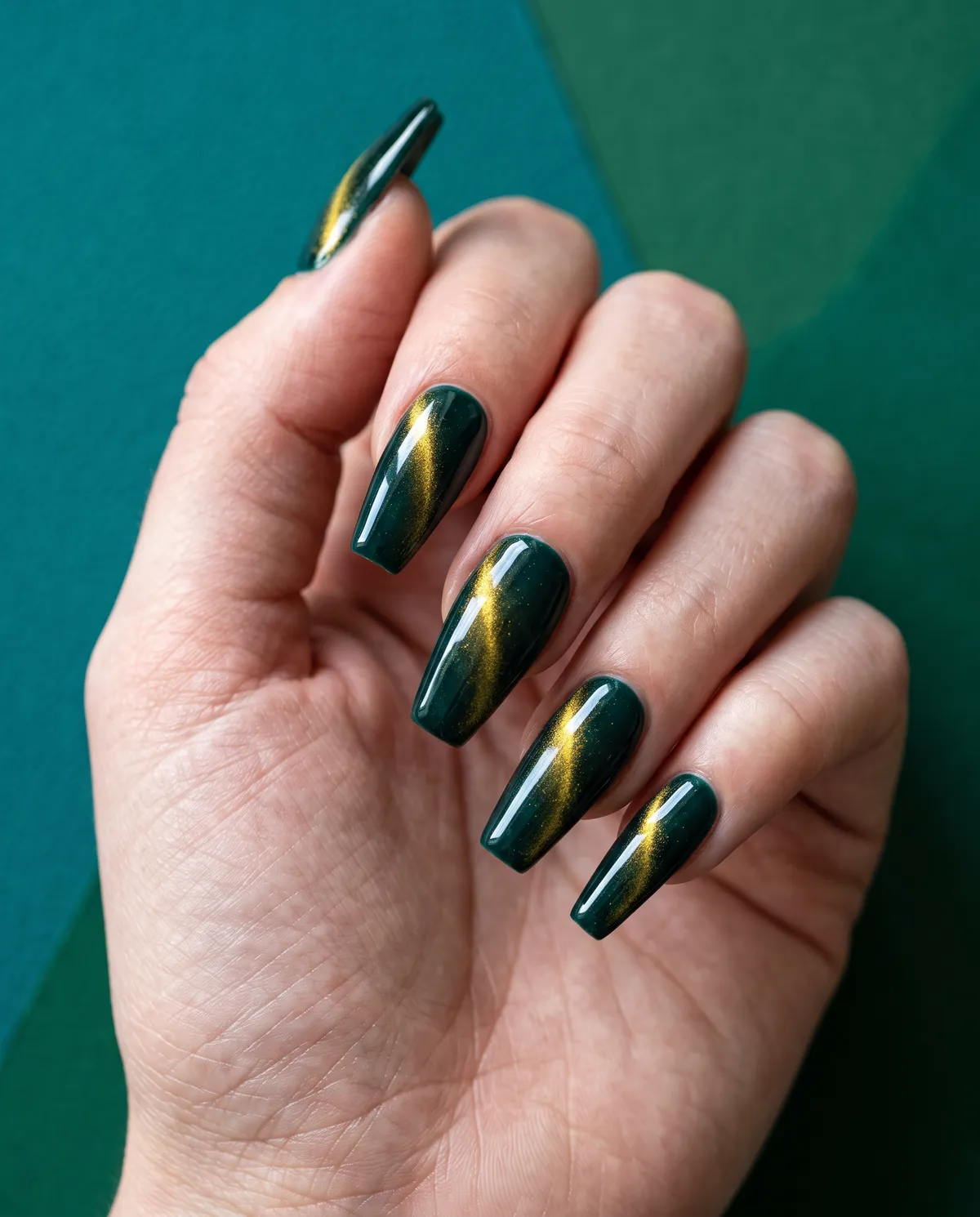 Midnight Teal Cat Eye — coffin cat eye nails with blackened teal gel base with a gold magnetic sweep, coffin shape, long length, glossy finish