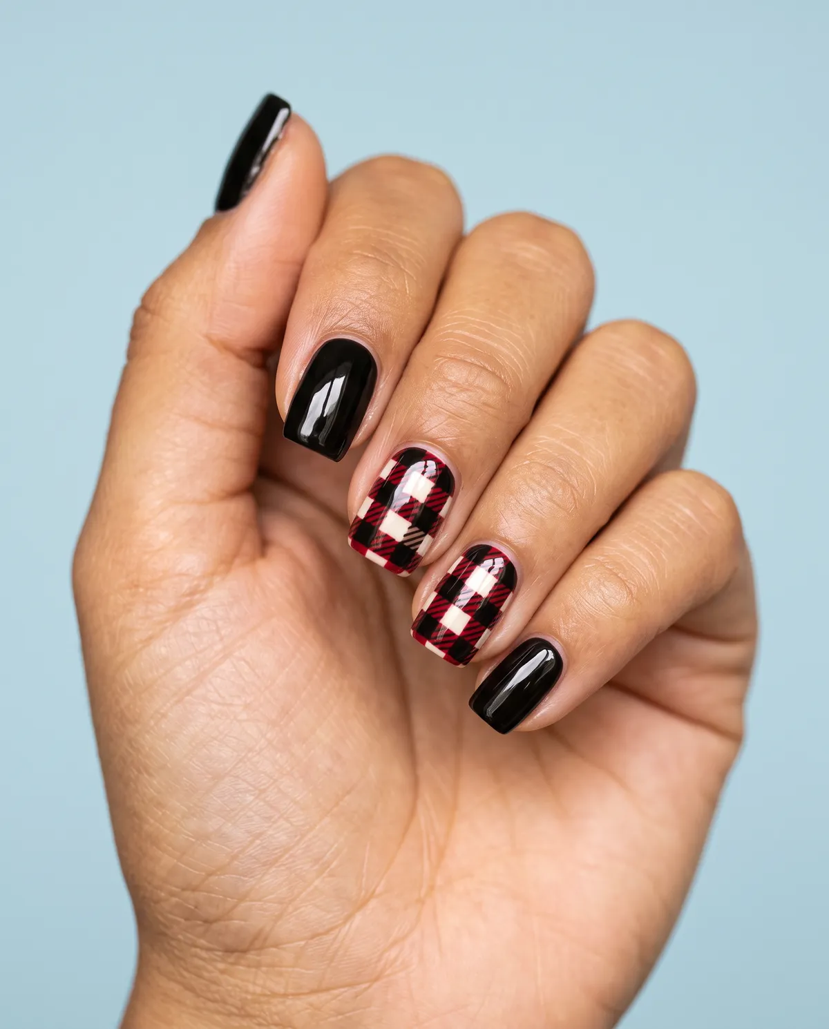Buffalo Plaid Accent — square christmas nails with paint a small buffalo plaid pattern in red, black, and cream on one accent nail per hand