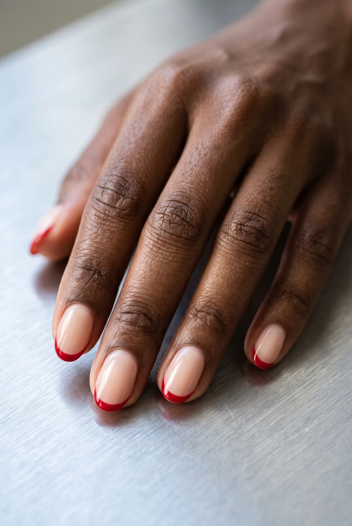 Classic Crimson Tips — round christmas nails with i'd like a sheer nude base with a classic thin red french tip on round nails