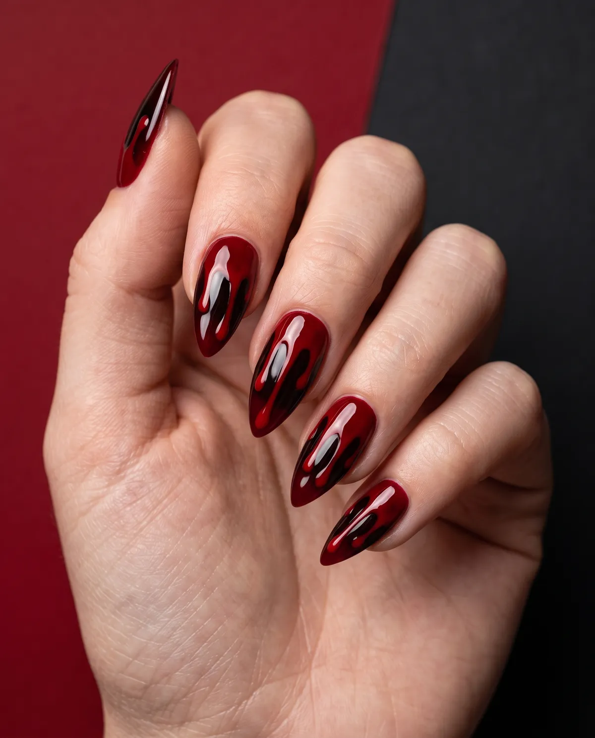 Blood Drip Stiletto — stiletto halloween nails with deep red gel base with a glossy red-on-black drip effect painted down the nail, stiletto…