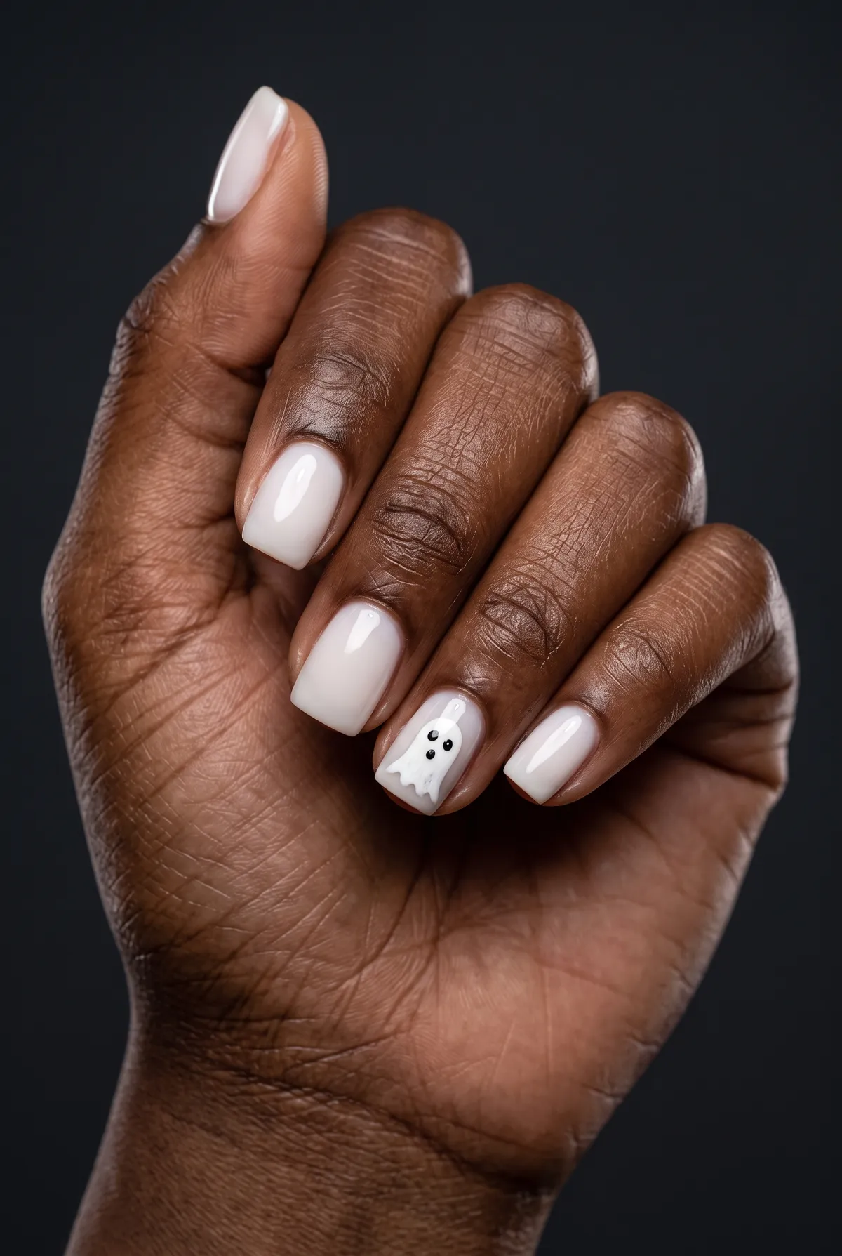 Ghost Whisper Sheer — square halloween nails with sheer milky white base on short square nails with one small hand-painted ghost accent on…