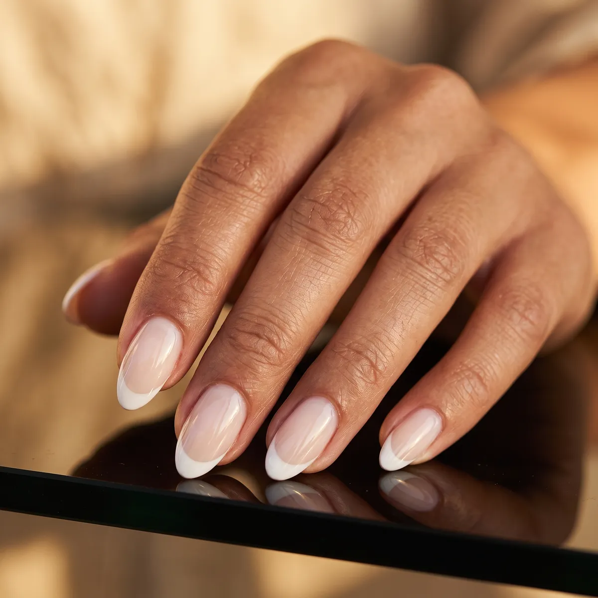 Milky Base White French — almond french nails with milky sheer base, soft white french tip with a natural smile line, medium almond, high gloss