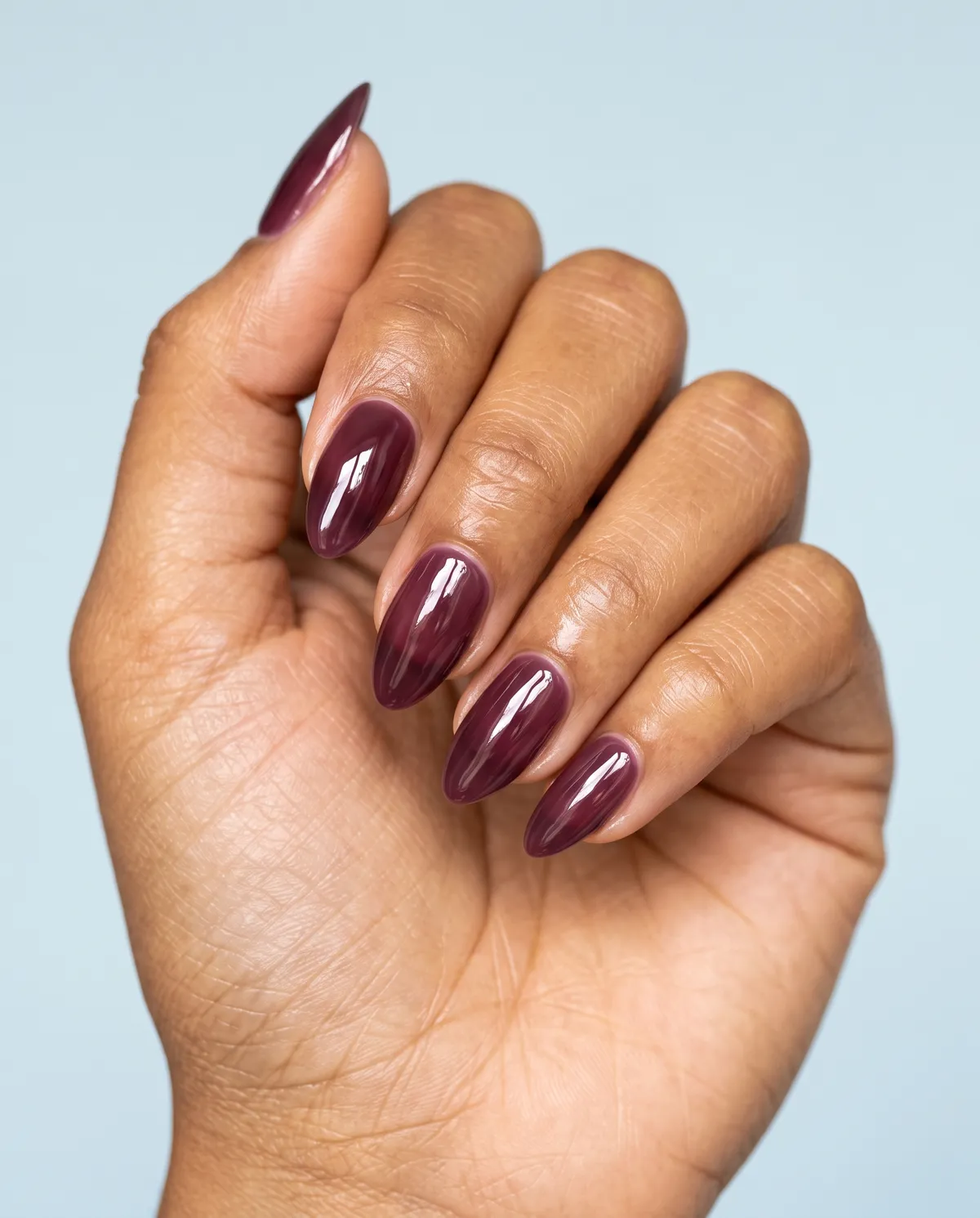 Plum Glaze — almond winter nails with almond shape, build deep plum jelly polish in three thin coats, seal with a high-shine glaze topcoat